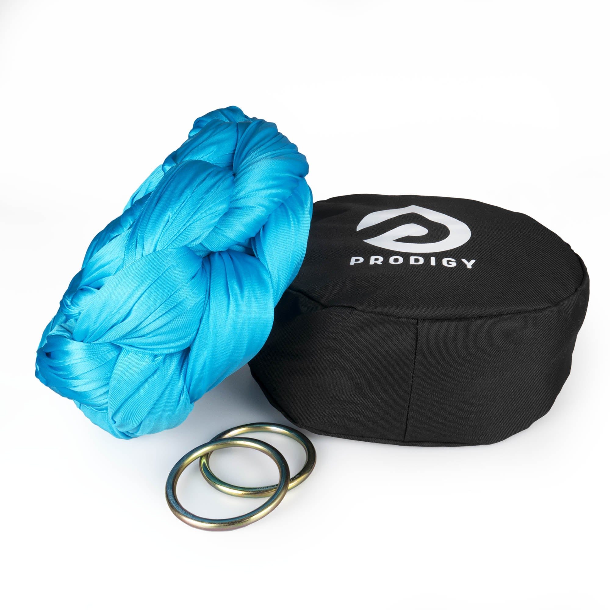 Prodigy 6m turquoise aerial yoga hammock resting on hammock bag with the rings
