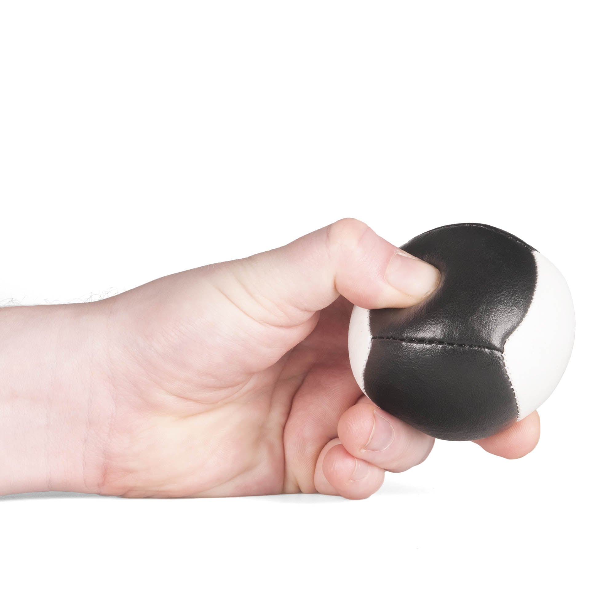 Firetoys black/white 110g thud juggling ball being squeezed