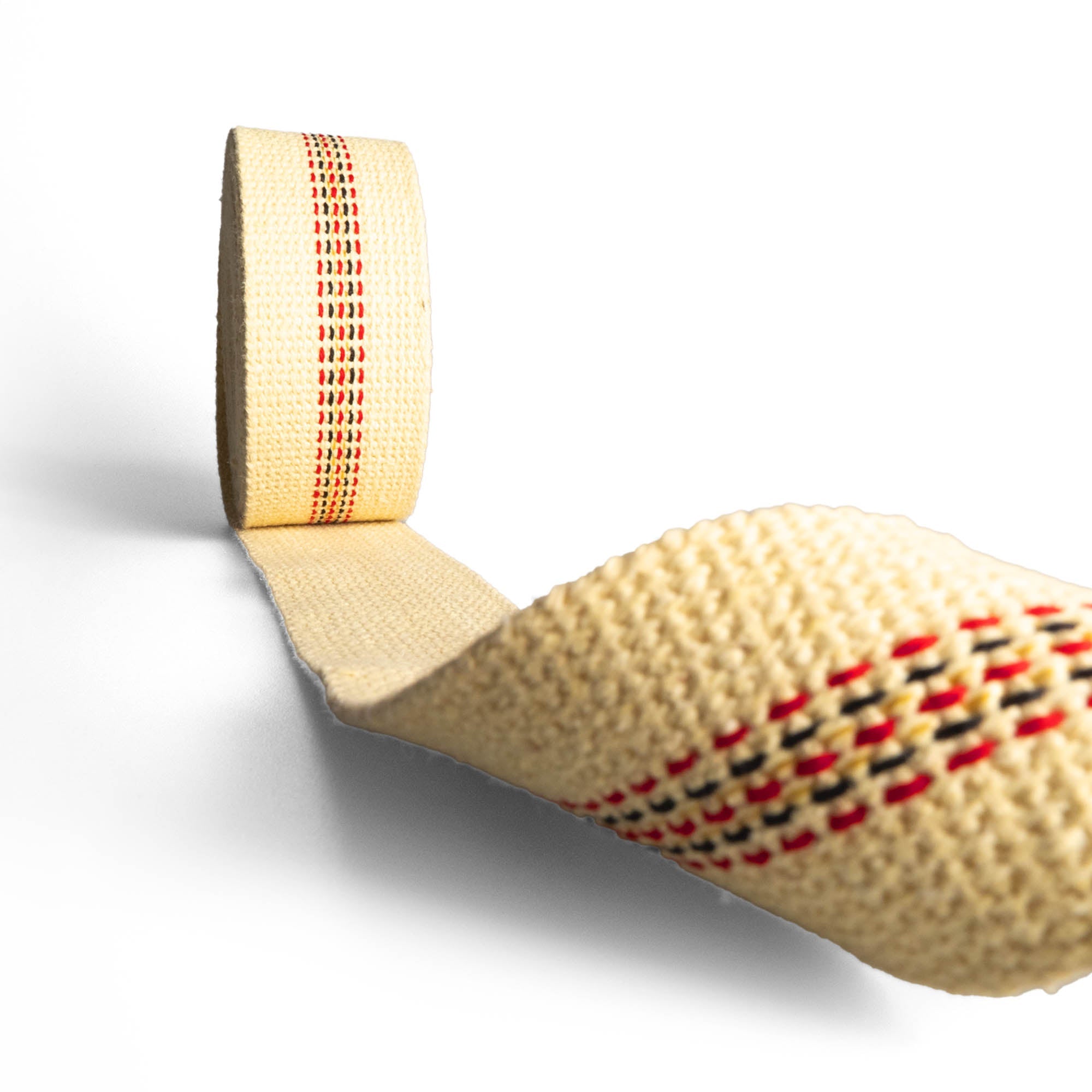 Firetoys fire wick on its side partially unrolled, with wick folding over