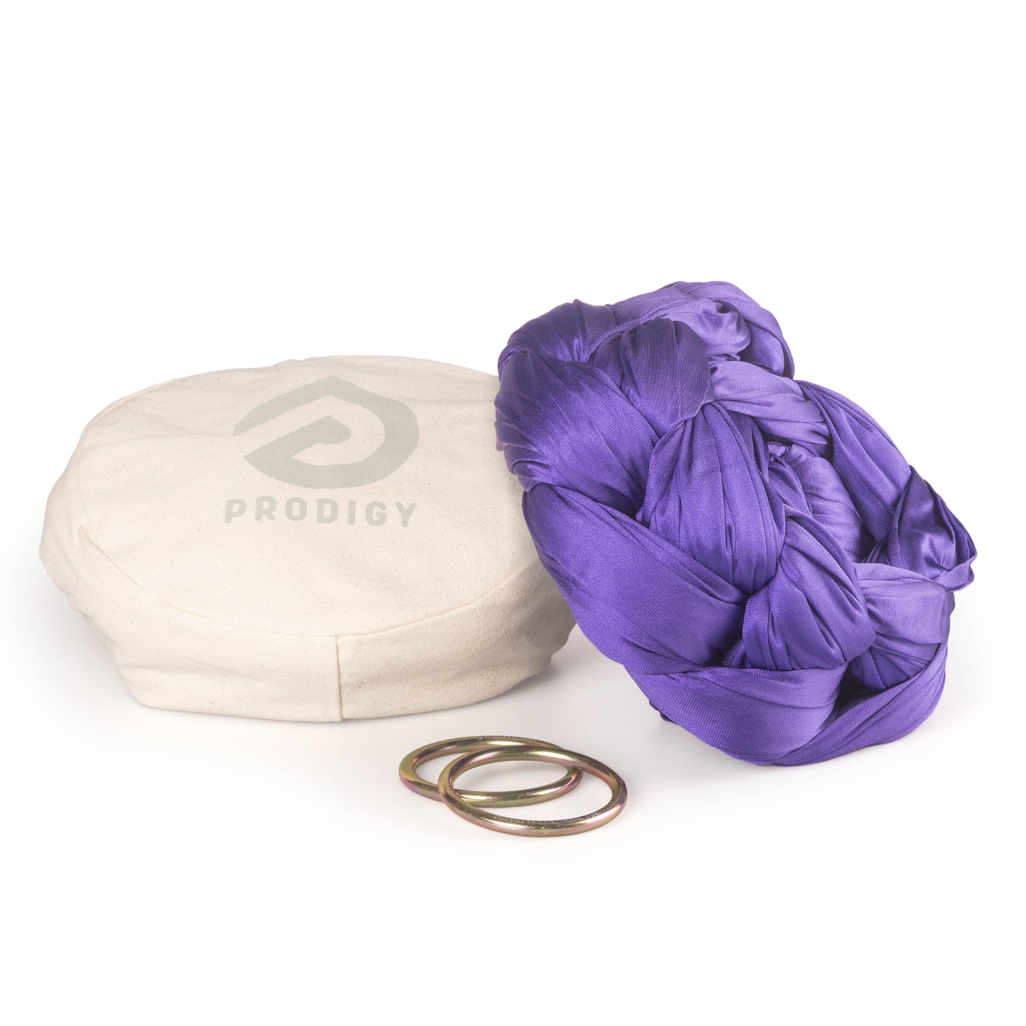Purple yoga hammock resting on eco bag with O-rings laying in front