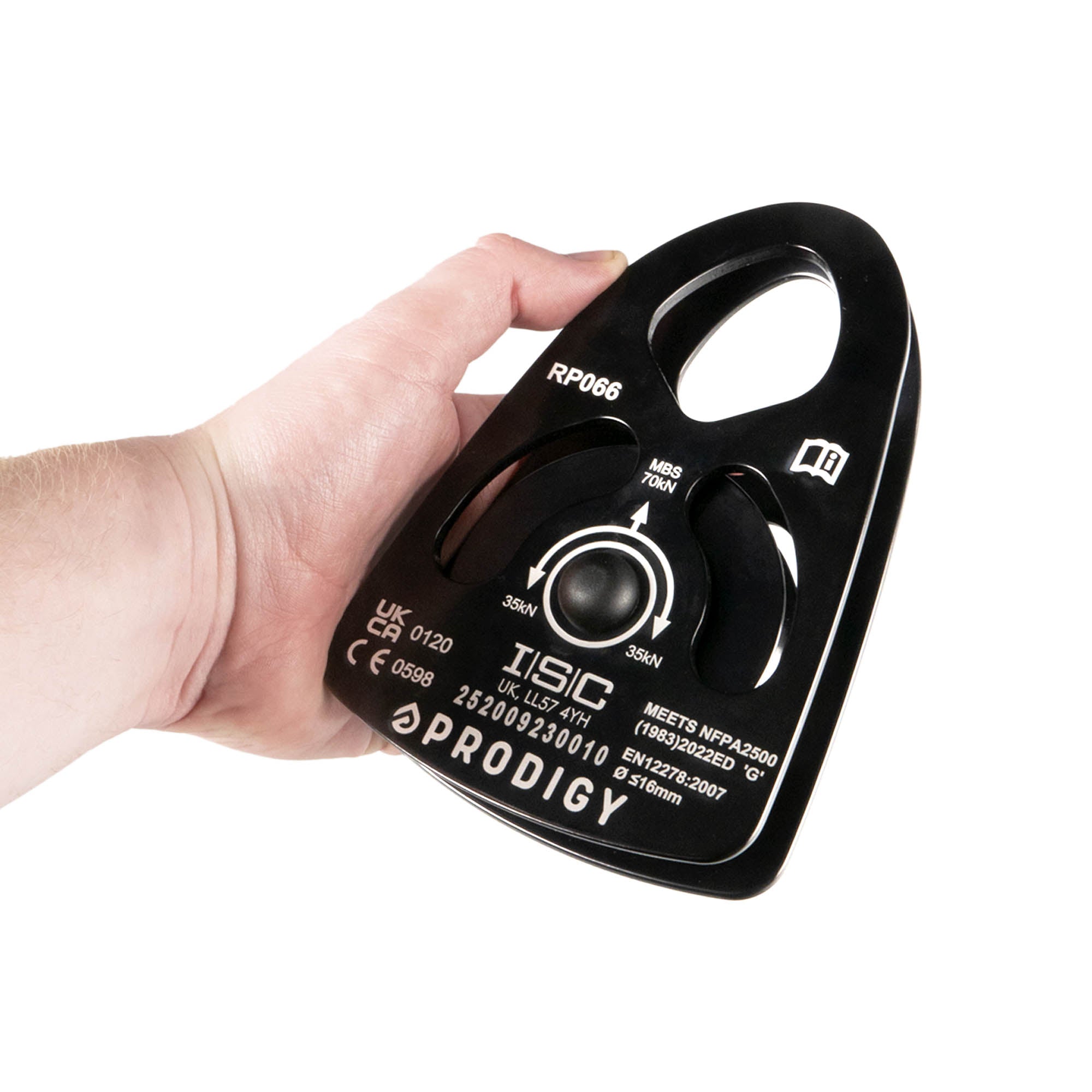 Hand holding a black ISC Prodigy pulley on a white background