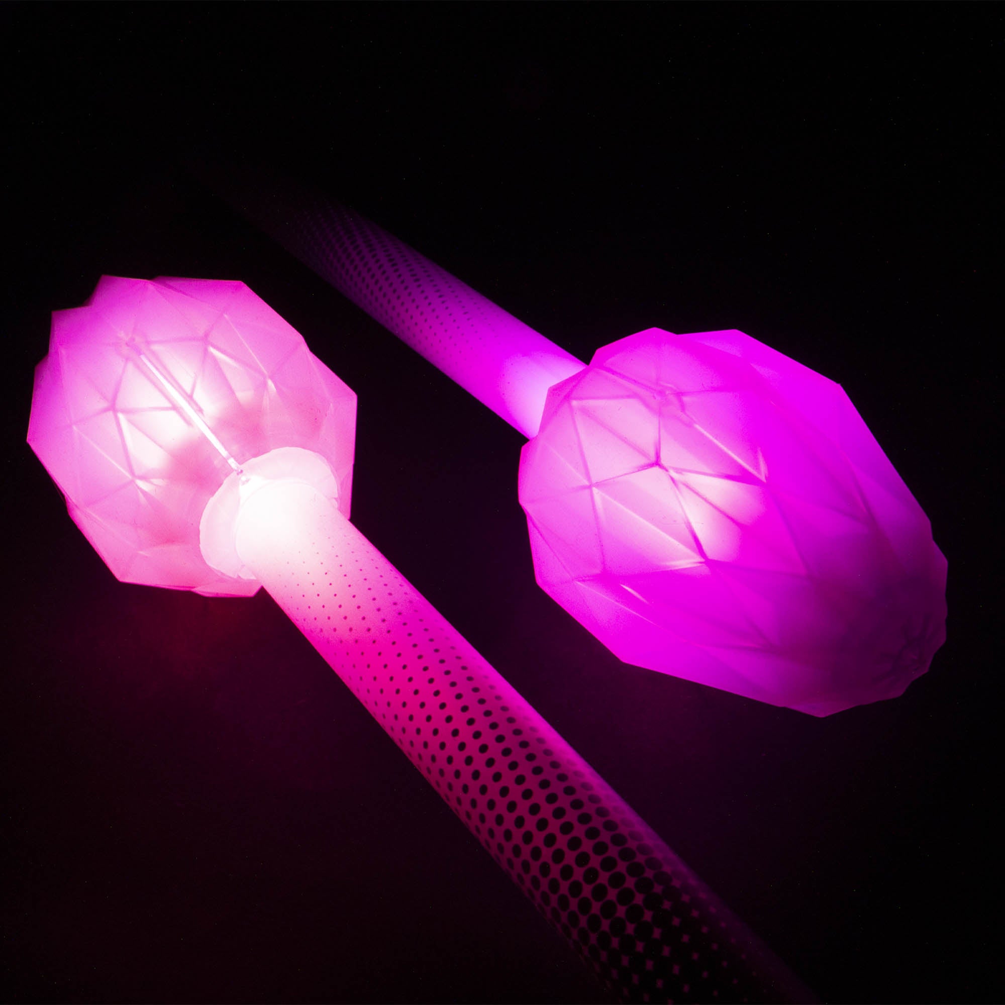 Glowing pink LED ends on a black background