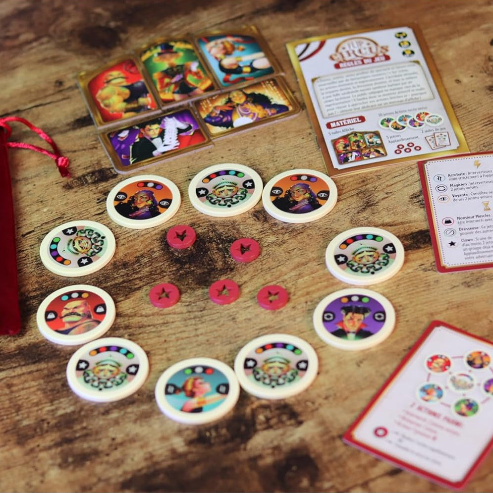 Board game components including cards and character tokens on a wooden surface