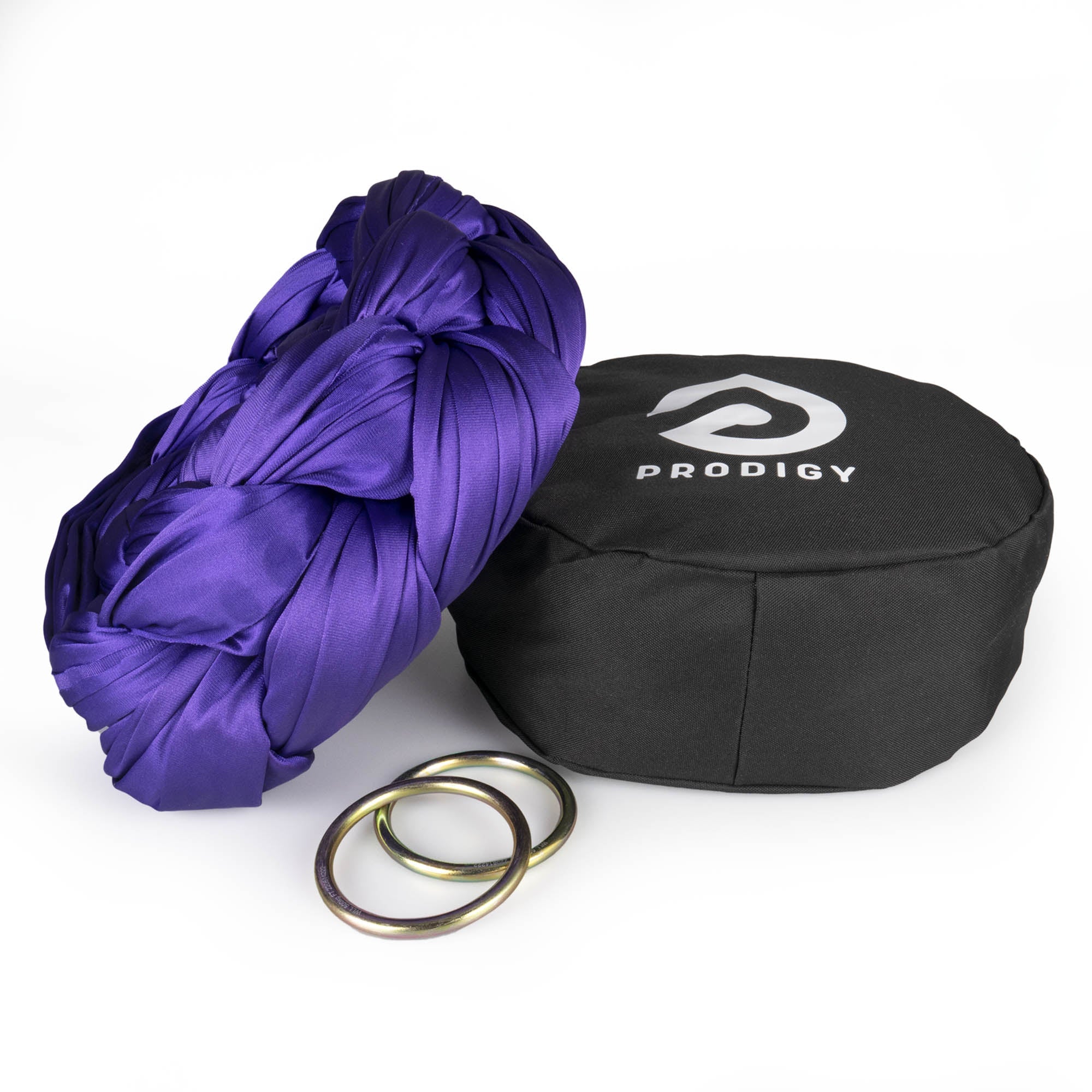 Prodigy 6m purple aerial yoga hammock resting on hammock bag with the rings