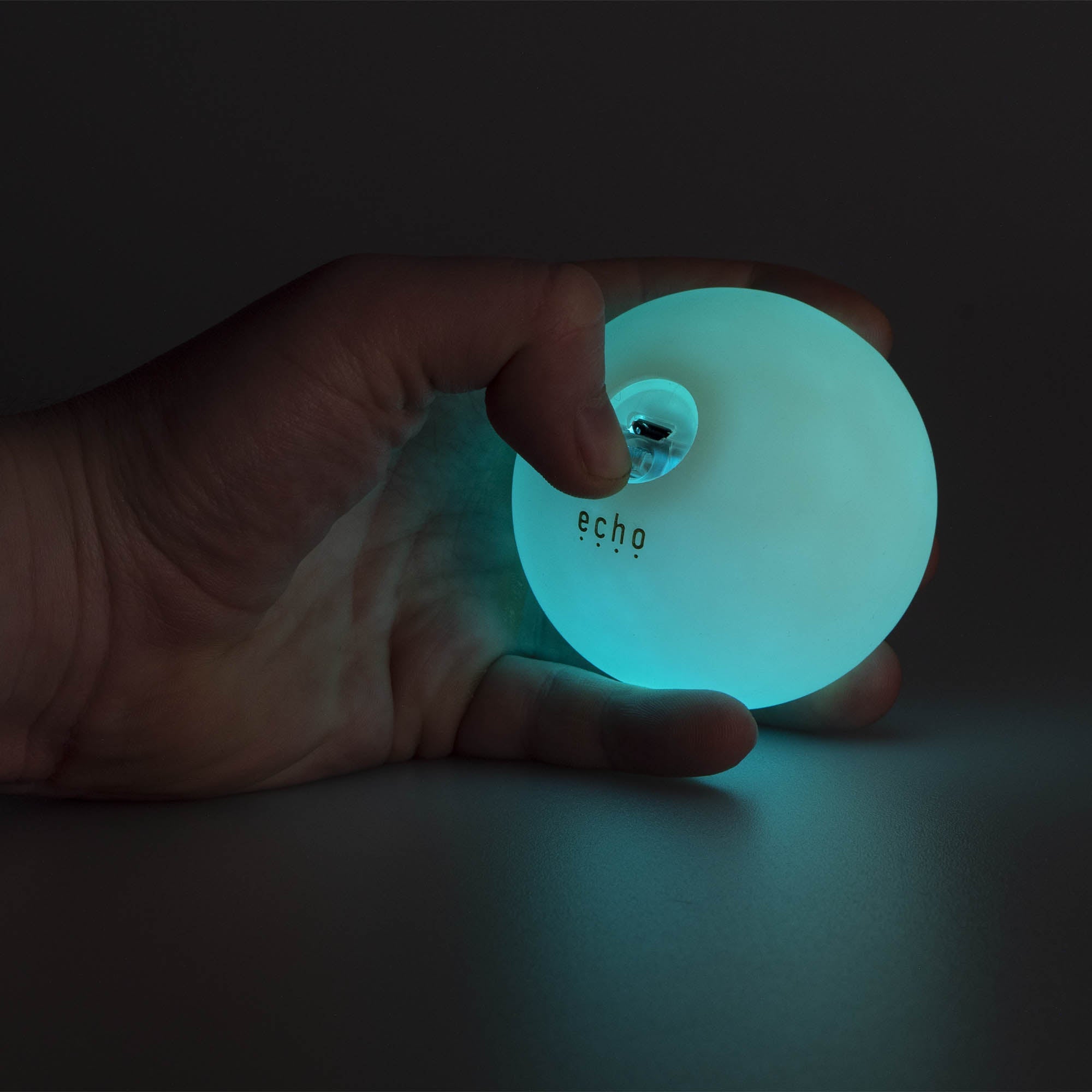 Echo glow juggling ball glowing in hand finger pressing switch 