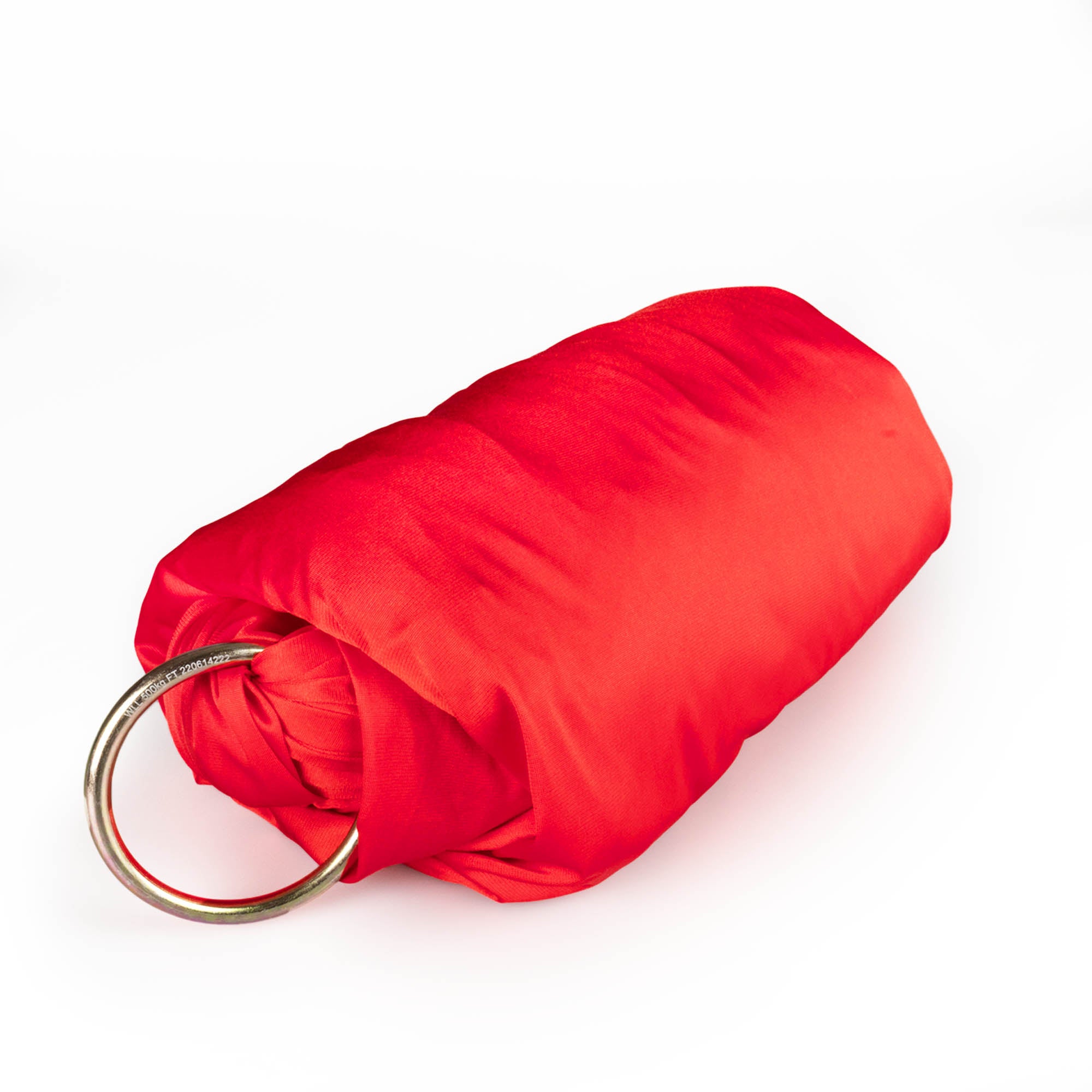 Red yoga hammock rolled up with ring attached