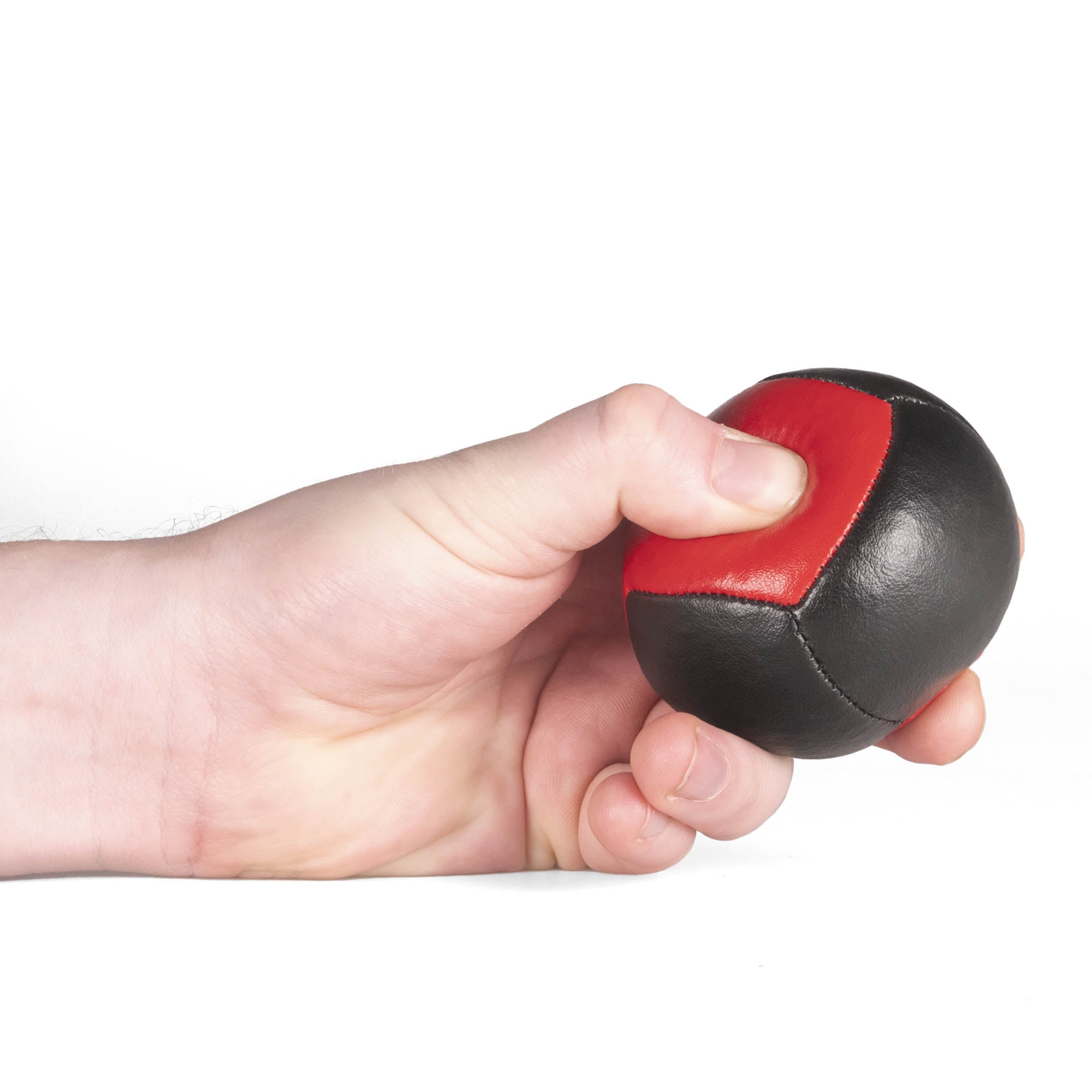 Firetoys red/black 110g thud juggling ball being squeezed