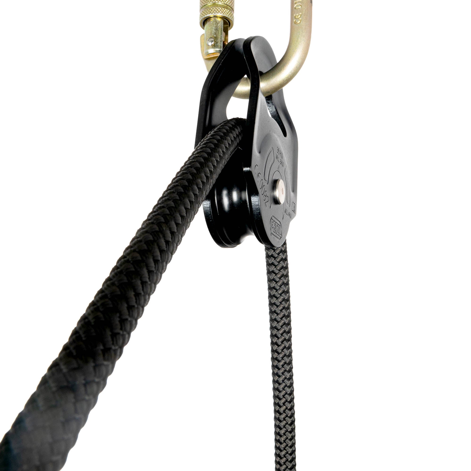 Petzl rescue pulley in black attached to carabiner rope pulling through