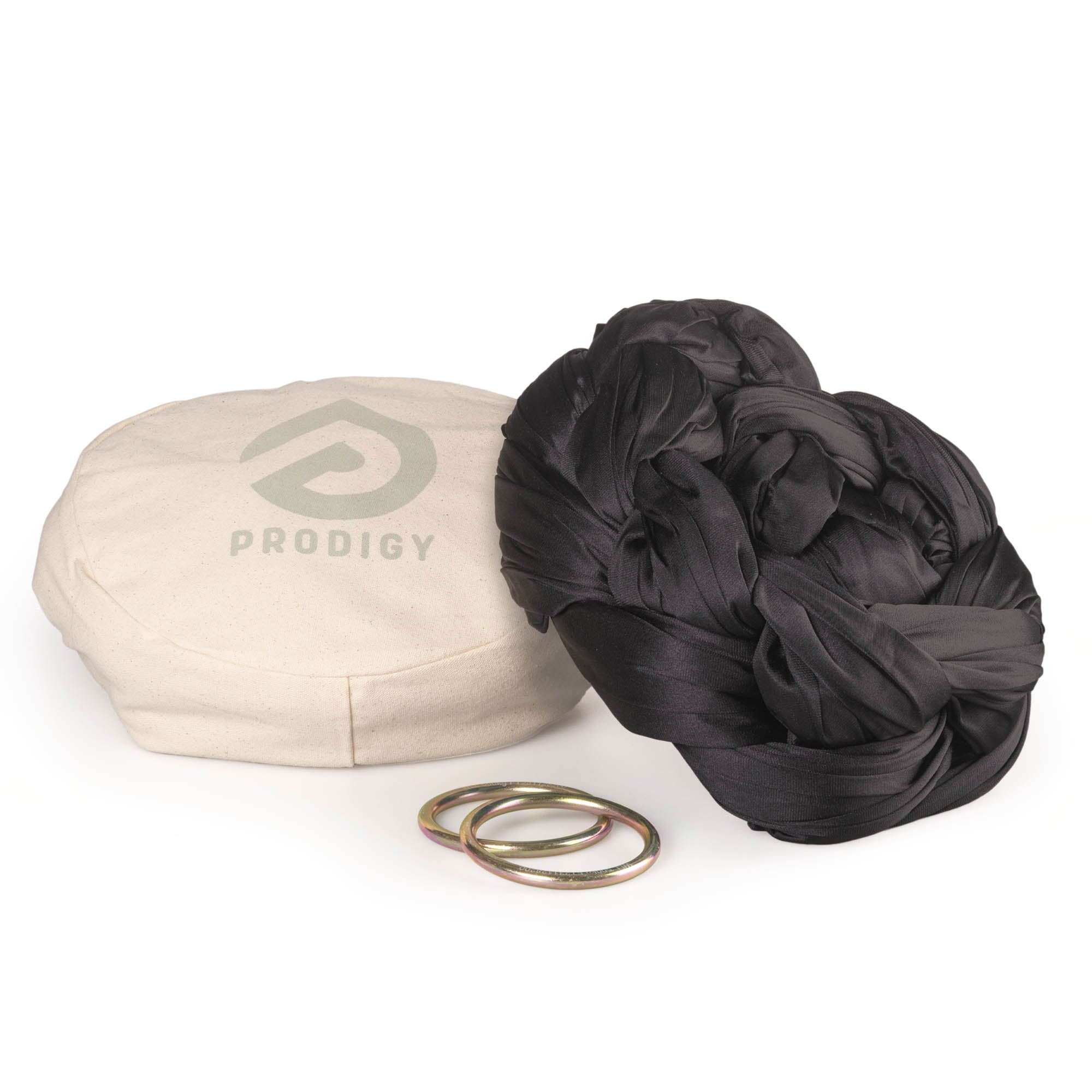 Black yoga hammock resting on eco bag with O-rings laying in front