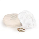 White yoga hammock resting on eco bag with O-rings laying in front