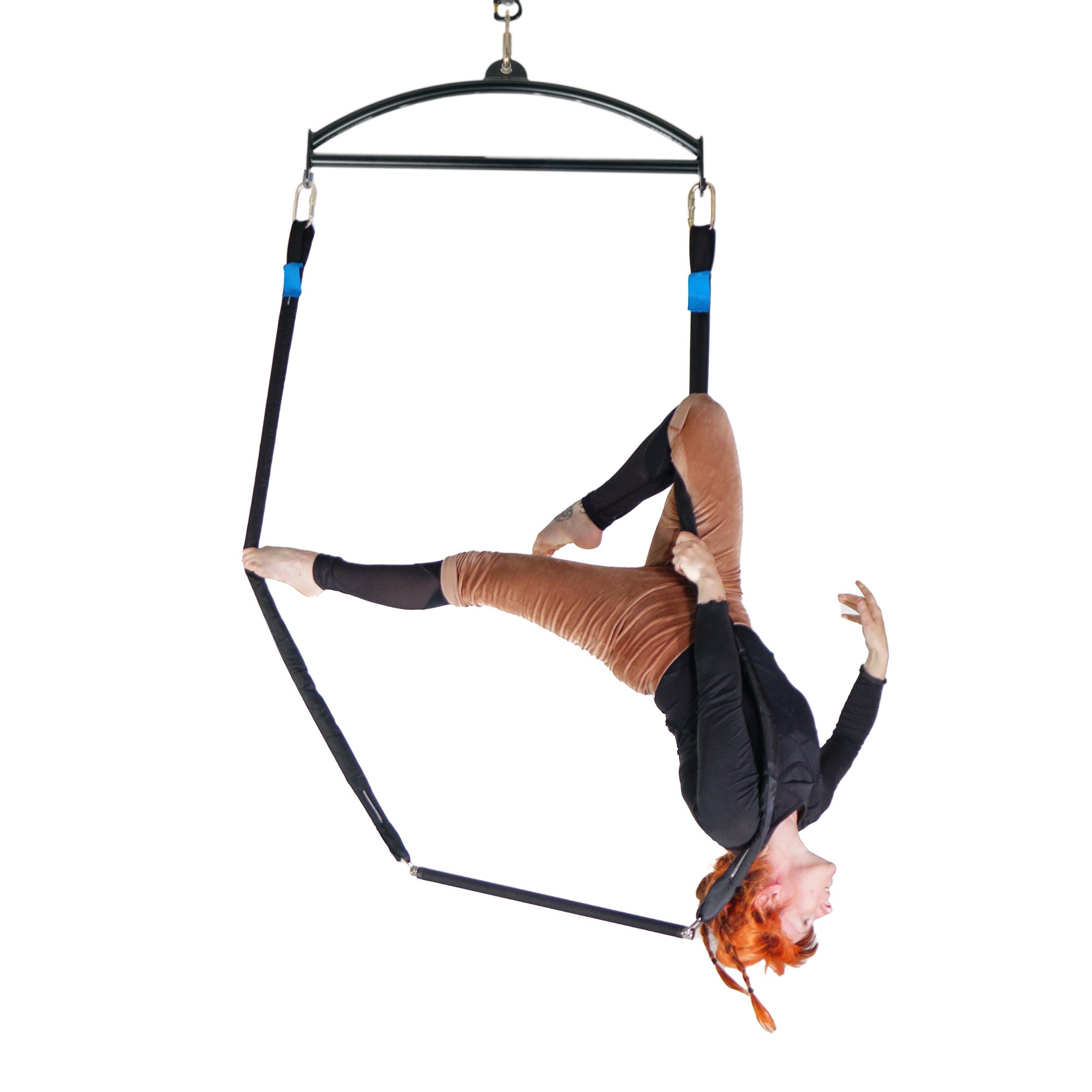 Trapeze attached to spreader bar with performer
