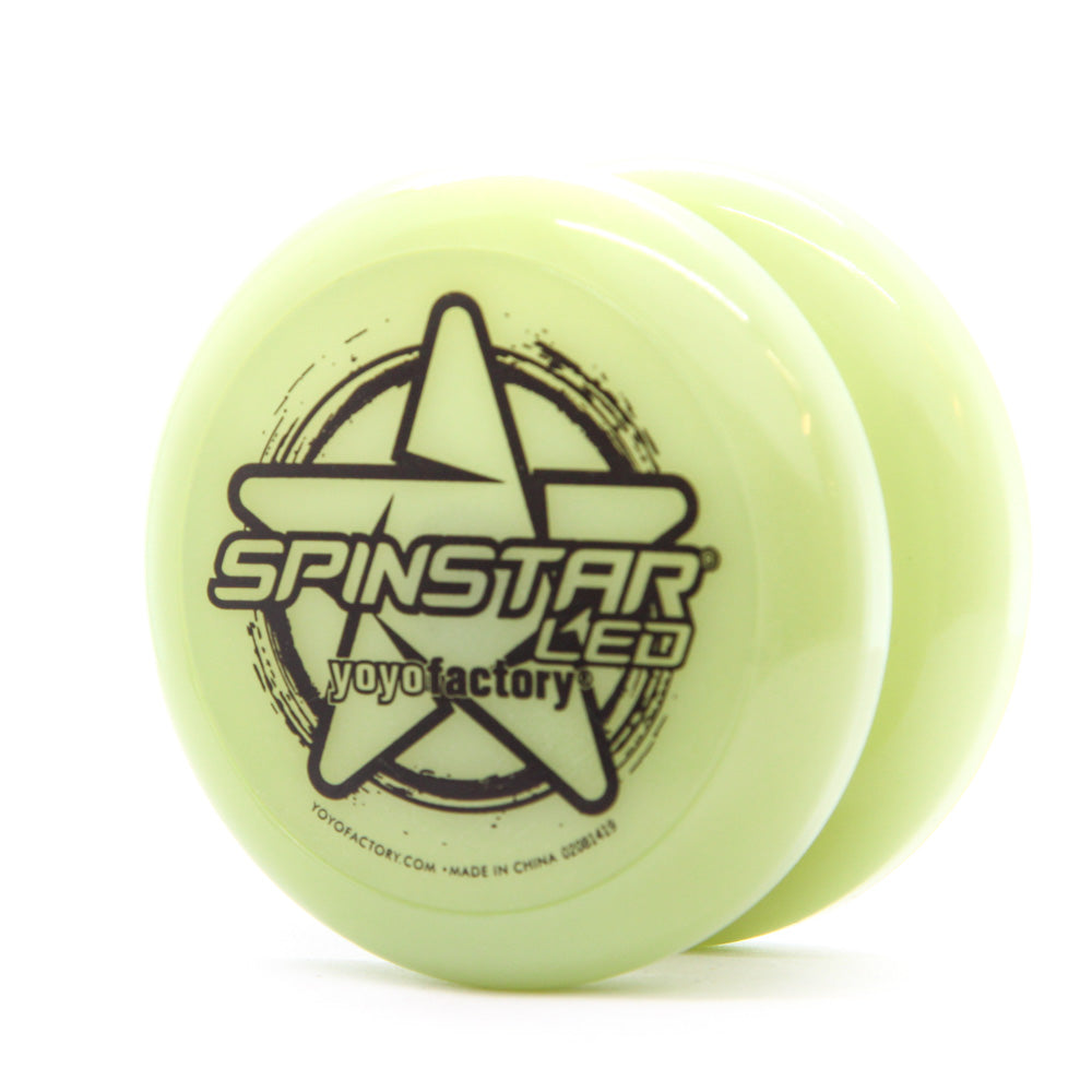 yoyo with glow-in-the dark body and black writing on the side