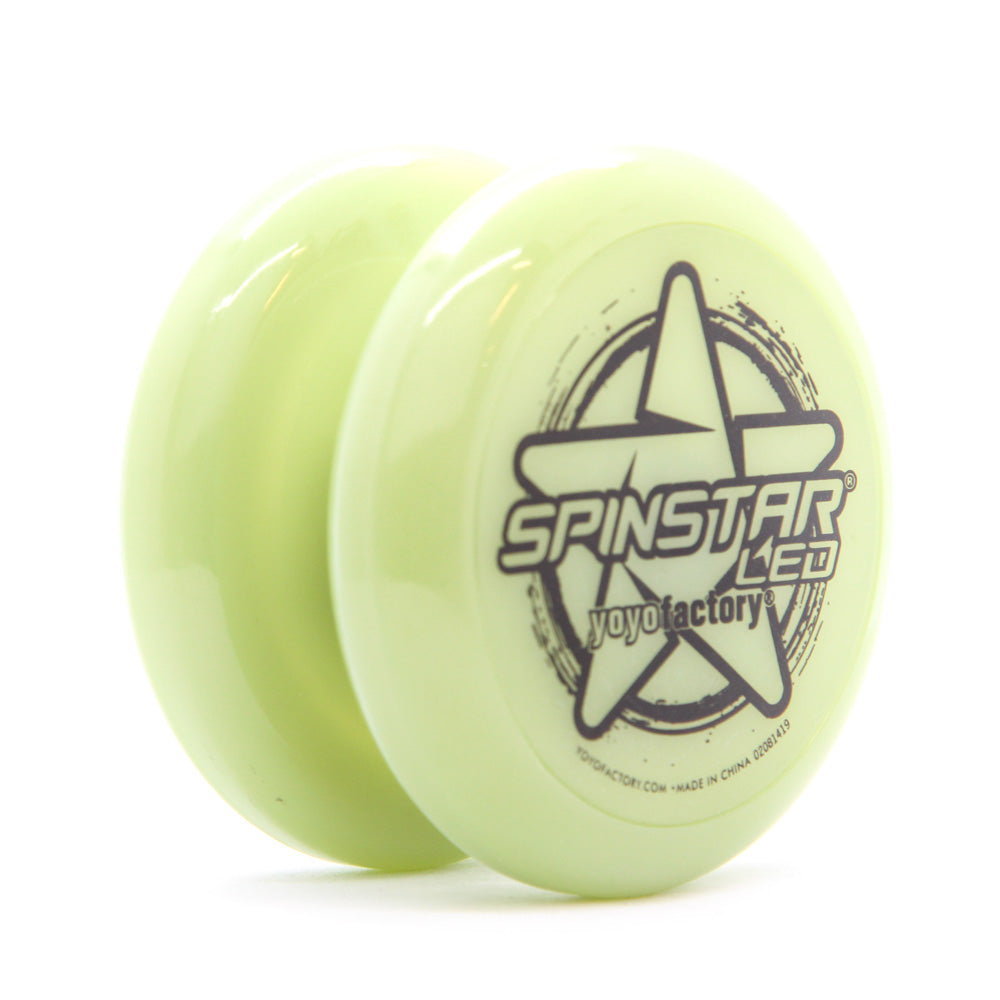 yoyo with glow-in-the dark body and black writing on the side